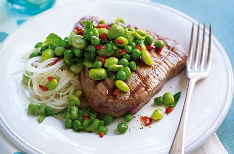 Ready in moments, grilled tuna steaks are packed with flavour and goodness. Serve alongside our edamame salad and some cooked rice noodles, and you won't need more than a little squeeze of lime and some sliced chilli to garnish this hearty yet healthy dish.
